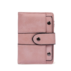 Pink matte faux leather trifold wallet for women with triple snap buttons on white background
