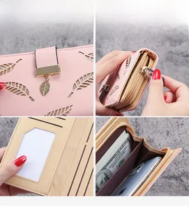 Pink faux leather long wallet detail showing leaf cutout and gold leaf pendant