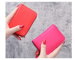 Litchi pattern leather card holder wallets in red and fuchsia with U-shaped zip closure