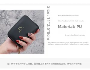 Detail view of black PU leather card holder with 9 slots and 2 coin pockets in hand