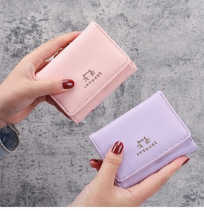 Close-up of small faux leather tri-fold wallet with cat pattern and love cat text