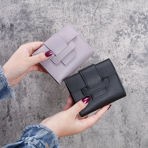 Three-fold leather wallet for women with drawstring and textured litchi grain finish