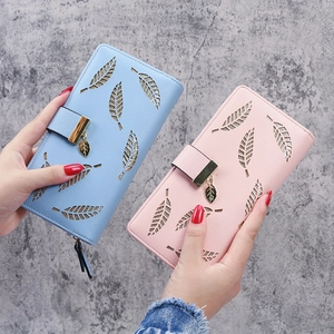 Elegant long women's wallet with hollow leaf design and metallic charm in blue and pink