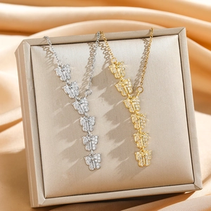 Elegant butterfly pendant necklaces in gold and silver with micro-pave crystals