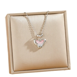 Pink gradient butterfly heart pendant necklace in silver stainless steel on display