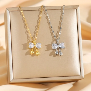 Titanium steel bowknot necklace with sparkling zircons in gold and silver finish