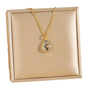 Luxurious gold titanium necklace with a faceted champagne teardrop pendant in a gift box