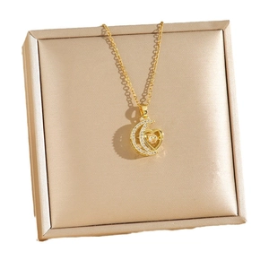 Elegant gold heart and crescent moon pendant necklace with sparkling moving zircon stones