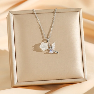 Exquisite flower pendant necklace with white petals and marquise crystals on a silver chain