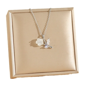 Elegant floral pendant necklace with shell petals and sparkling marquise crystals in a gift box