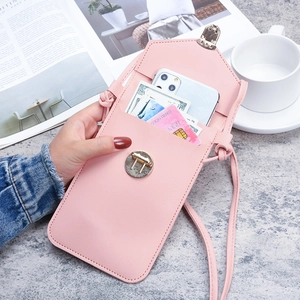 Pink PU leather crossbody phone bag with gold metal buckle on marble background