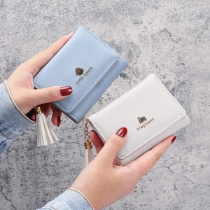 Women's tri-fold short leather wallets with cute tassels and metal animal designs