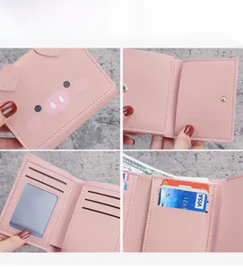 Detailed interior of a cute pink cartoon pig trifold wallet with multiple card slots