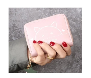 Detailed view of pink leather wallet featuring a white cat print and star-shaped zipper charm