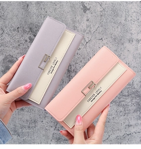 Detail of long tri-fold wallets in pastel lavender and pink with pebble grain leather texture