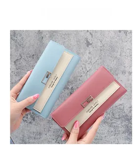 Detailed comparison of pink and light blue PU leather wallets with metal buckle closure