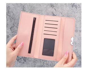 Detail view of pink trifold wallet interior with card slots and a clear ID window