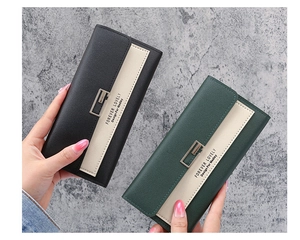 Close-up of long tri-fold wallets in black and dark green PU leather with G-buckle