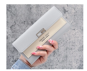 Close-up of tricolor long wallet with silver square clasp and printed lettering