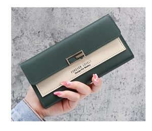 Detail of multi-functional tri-fold long wallet in green and cream faux leather