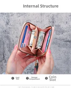 Detail view showing internal card slots and zippered coin pocket of the pink wallet