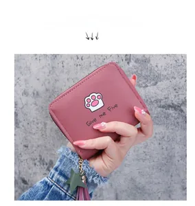 Short zip-around wallet in dusty pink PU leather featuring a cute cat paw print