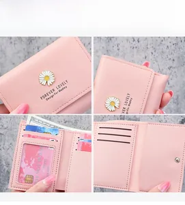Pink wallet interior details showing multiple card slots and a clear ID window