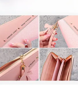 Detail showing pink long wallet with glitter finish, tassel charm, and multi-card slots