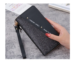 Detail of black long wallet with sequins and Forever Lovely print and wrist strap
