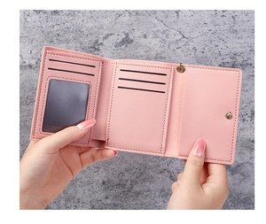 Detailed interior view of pink PU leather wallet showing card slots and ID window