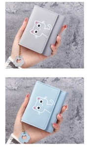 Detail of short PU leather wallets with cat patterns and golden cat paw charms