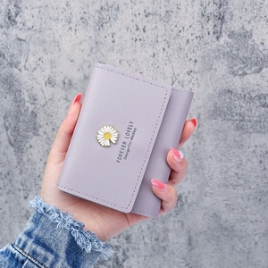 Short purple tri-fold wallet for women with daisy emblem and lychee texture