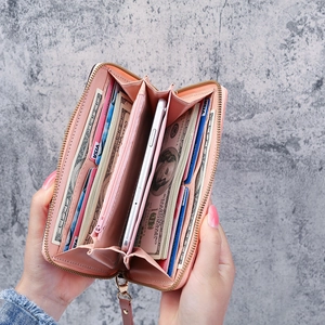 Pink faux leather long zip wallet with multiple card slots and smartphone compartment