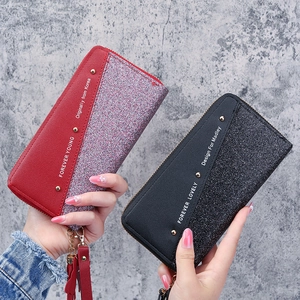 Long patchwork zip wallet for women featuring sequins and fringe tassel charm