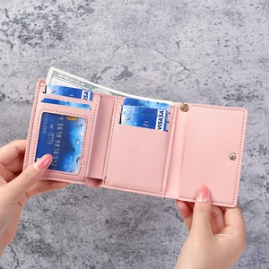 Pink lychee texture tri-fold wallet for women showing card slots and cash compartment