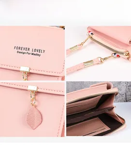Detail view of pink crossbody bag interior with card slots, coin pocket and golden zipper
