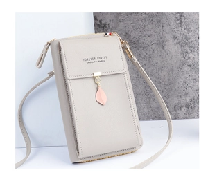 Detail of grey crossbody phone bag showing leaf charm and Forever Lovely logo