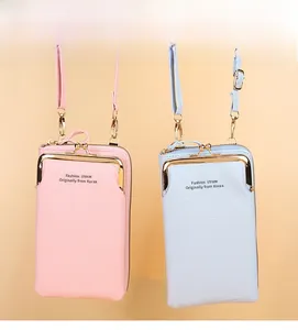 Close-up of minimalist crossbody phone bags with textured leather and metal clasps