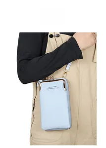 Detail of light blue lychee pattern crossbody phone wallet with gold metal buckle