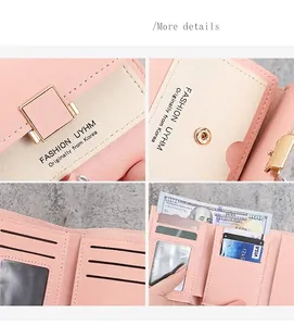 Detail view of pink trifold wallet with multiple card slots and metal snap closure
