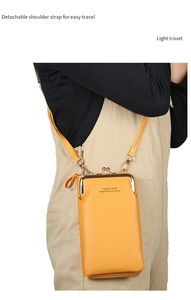 Detail of yellow lychee grain PU leather phone wallet with vintage metal clasp and strap