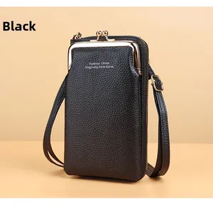 Detail view of black lychee grain wallet with gold hardware and adjustable strap