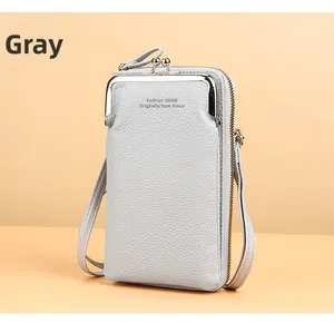 Detail of grey lychee leather crossbody phone bag with double zipper and metal clasp