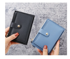 Detail of slim card holder with lychee pattern leather and gold snap button closure