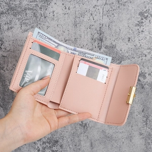 Pink tri-fold faux leather wallet with banknote compartment and multiple card slots