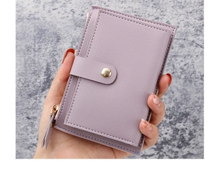 Close-up of lavender ultra-thin card wallet with lychee grain texture and gold snap button