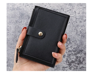 Close-up of black litchi leather card holder with gold zipper and snap button closure
