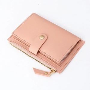 Slim pink faux leather card holder with zipper coin pocket and metal snap closure
