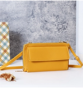 Détail du sac de téléphone jaune à écran tactile avec compartiments et fermetures éclair