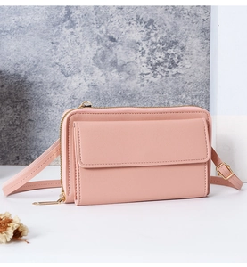Sac bandoulière rose pour téléphone avec fermeture éclair dorée et double compartiment